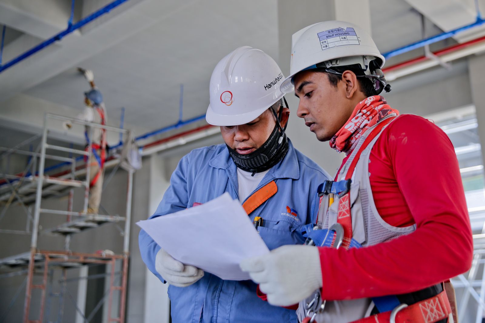 Engineers reviewing repair documentation on site